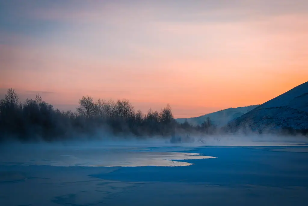 Steam rising from a river at sunrise on a bitterly cold morning